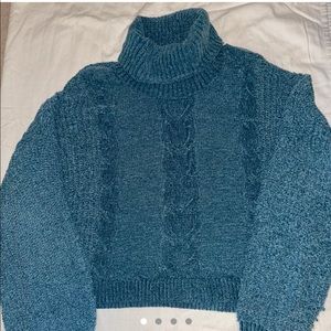 Women’s blue knit turtleneck sweater